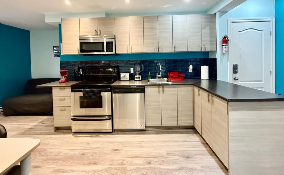 Kitchen or kitchenette, dishwasher, oven, stove, toaster