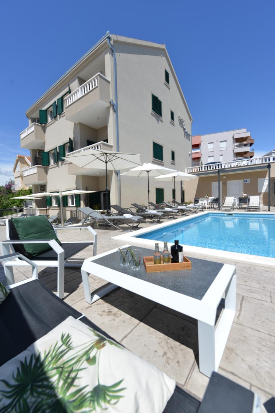 Property building, Pool view, Swimming pool, sunbed