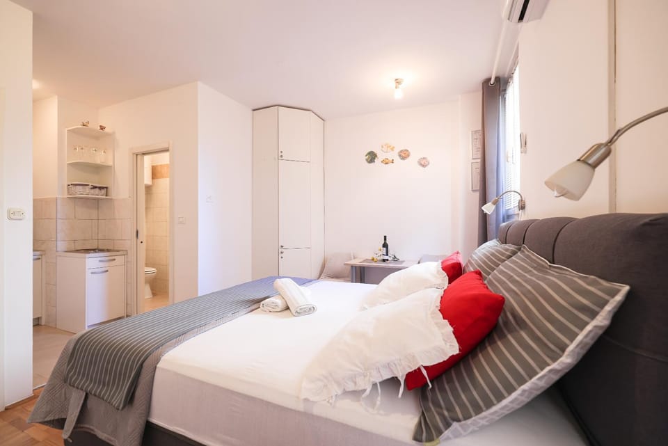 Bed, towels, wardrobe