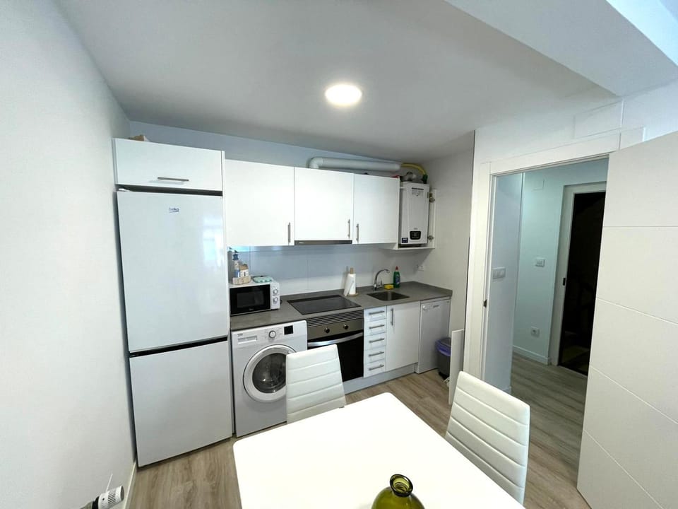 Kitchen or kitchenette, dishwasher, oven, stove, washing machine