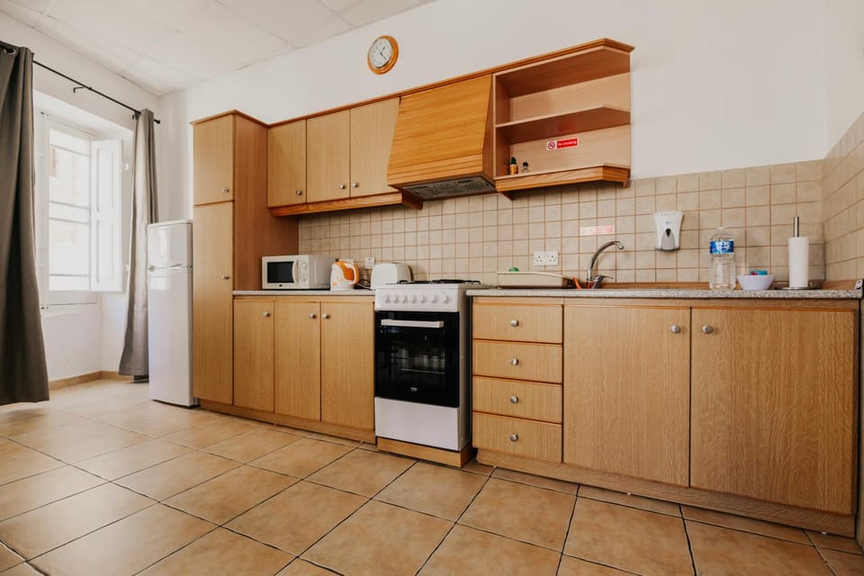 Kitchen or kitchenette, microwave, stove, toaster, kitchen