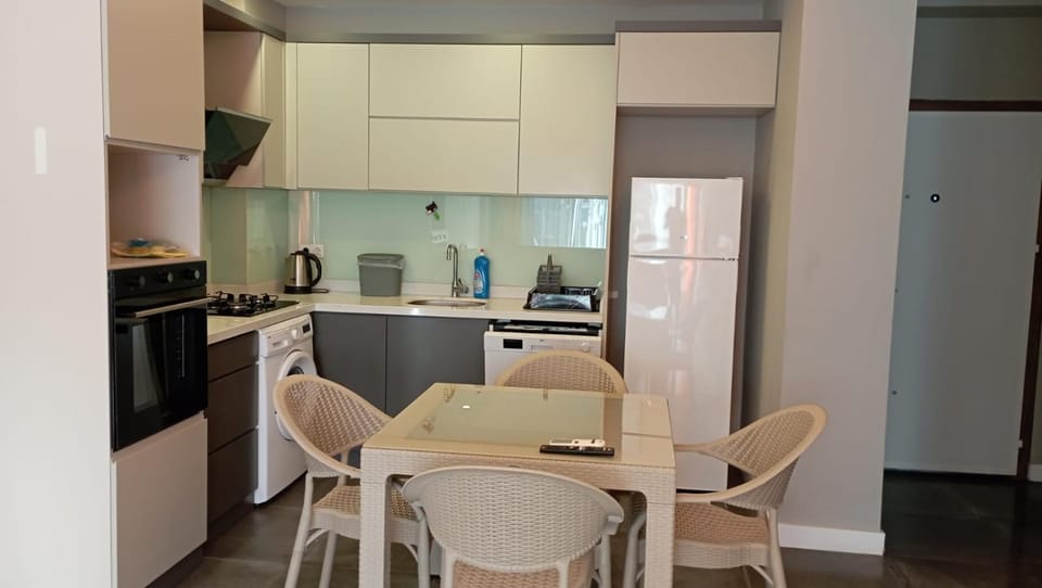 Dining area, dishwasher, oven, stove, kitchen