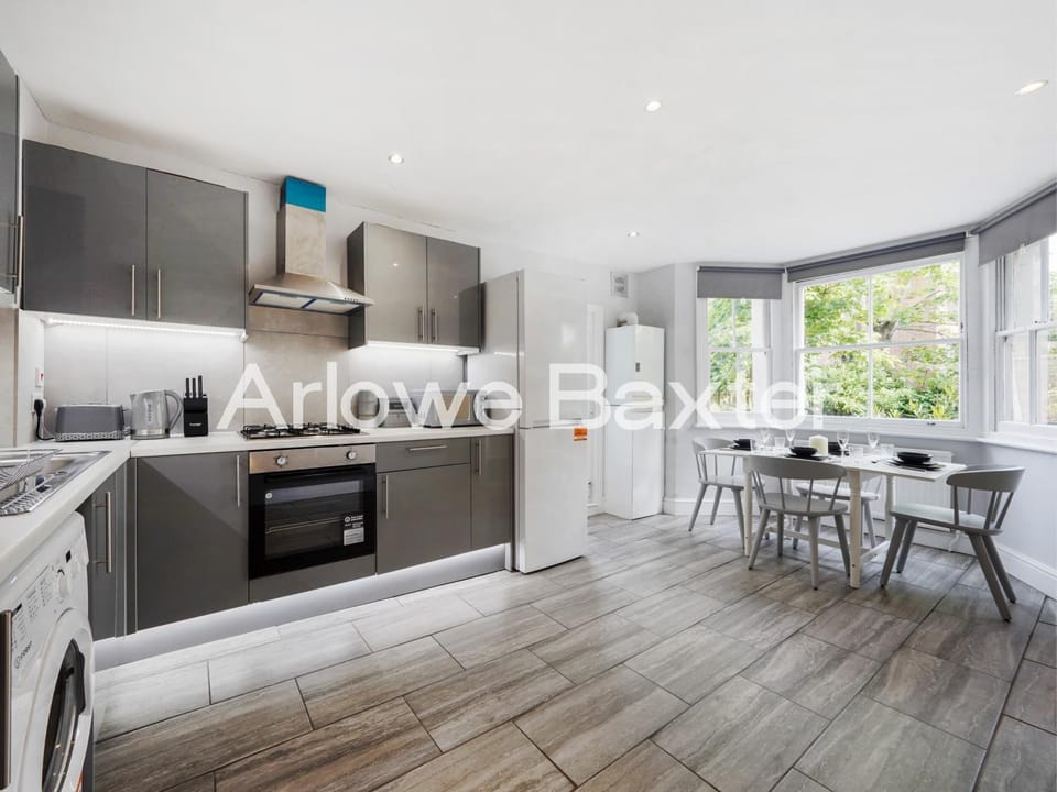 Kitchen or kitchenette, Dining area, oven, stove, toaster, washing machine