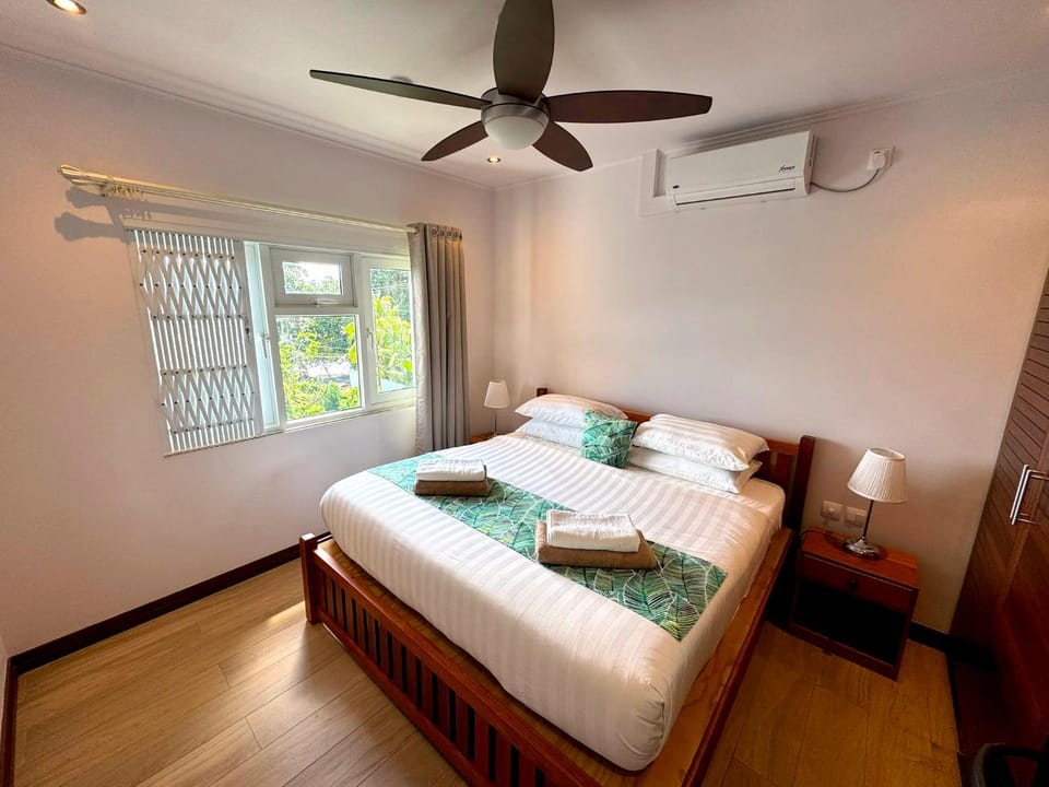 Bed, Photo of the whole room, Bedroom, towels, air conditioner