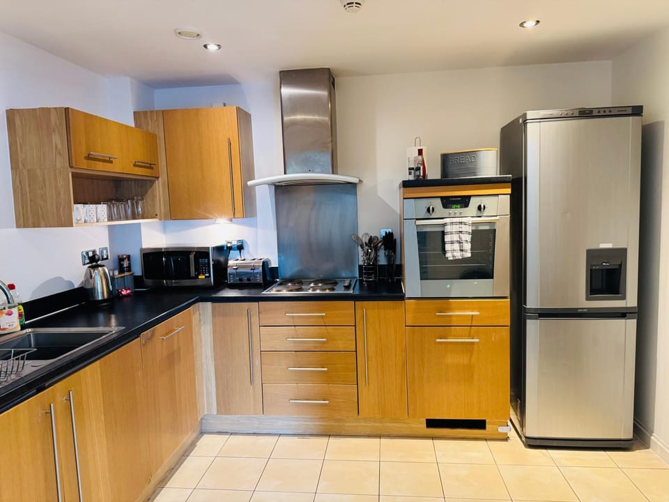 Kitchen or kitchenette, dishwasher, oven, stove, toaster