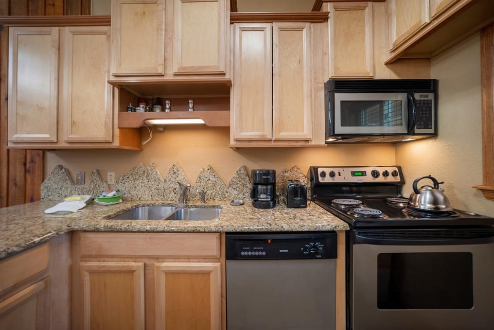 Kitchen or kitchenette, dishwasher, microwave, oven, stove, kitchen