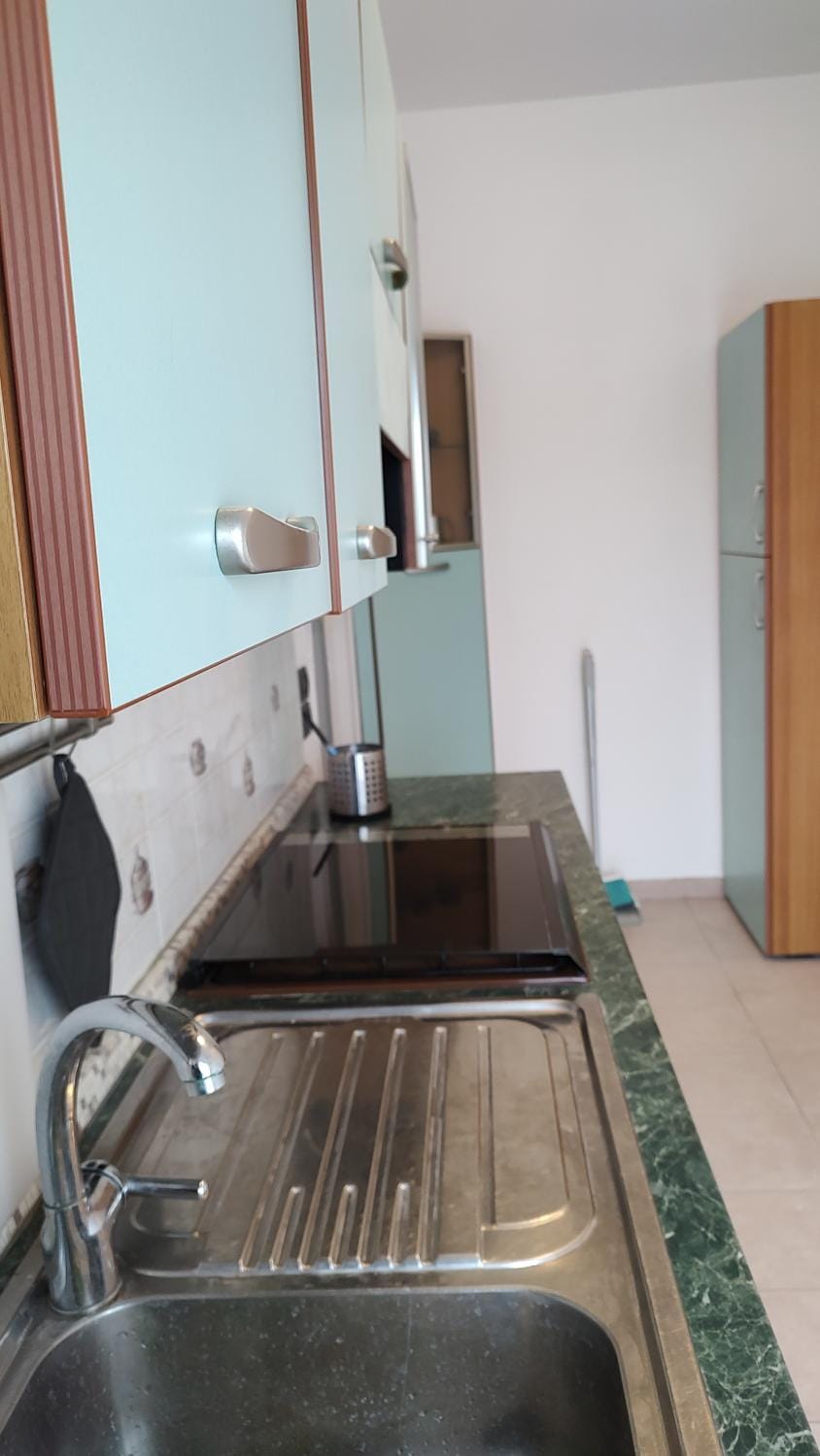 Kitchen or kitchenette, washing machine