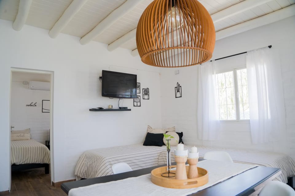 Bed, TV and multimedia, Living room, Photo of the whole room, Seating area, Bedroom