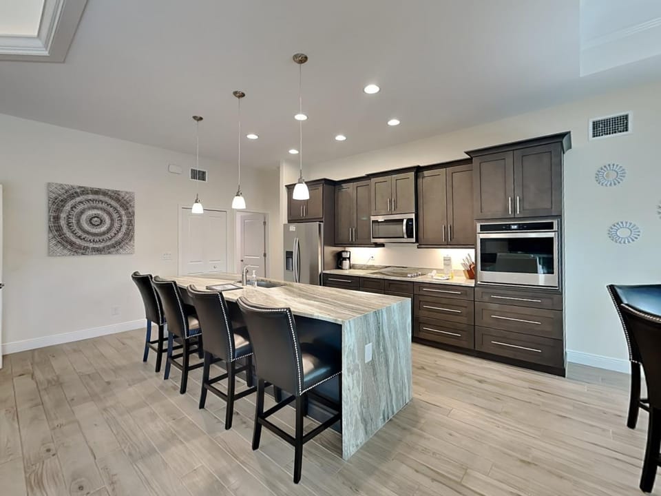 Kitchen or kitchenette, Seating area, furniture, microwave, oven, air conditioner