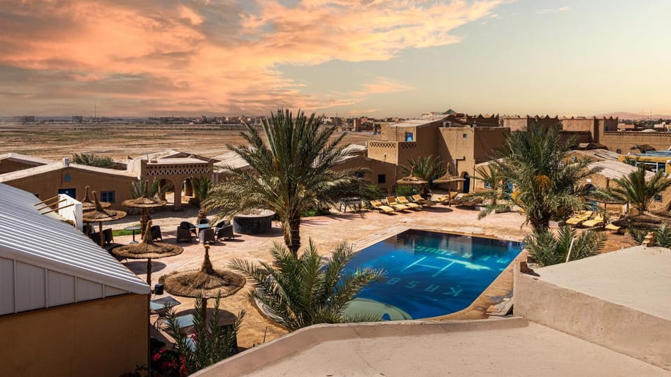 Property building, Patio, Day, Natural landscape, Pool view, Swimming pool, sunbed