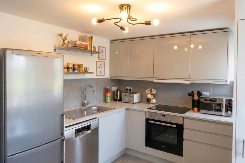 Kitchen or kitchenette, dishwasher, oven, stove, toaster