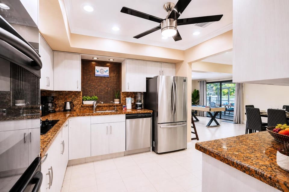 Kitchen or kitchenette, dishwasher, oven, stove