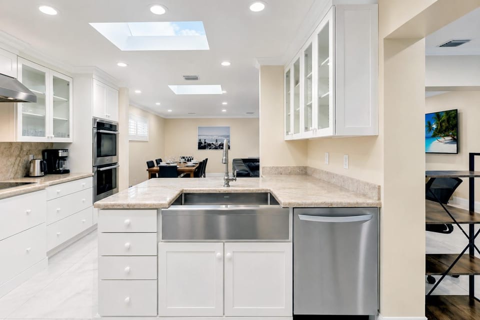 Kitchen or kitchenette, dishwasher, oven, stove