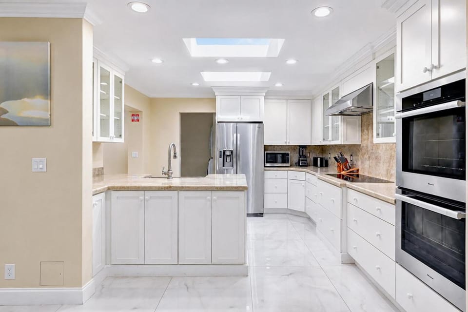 Kitchen or kitchenette, dishwasher, oven, stove, toaster