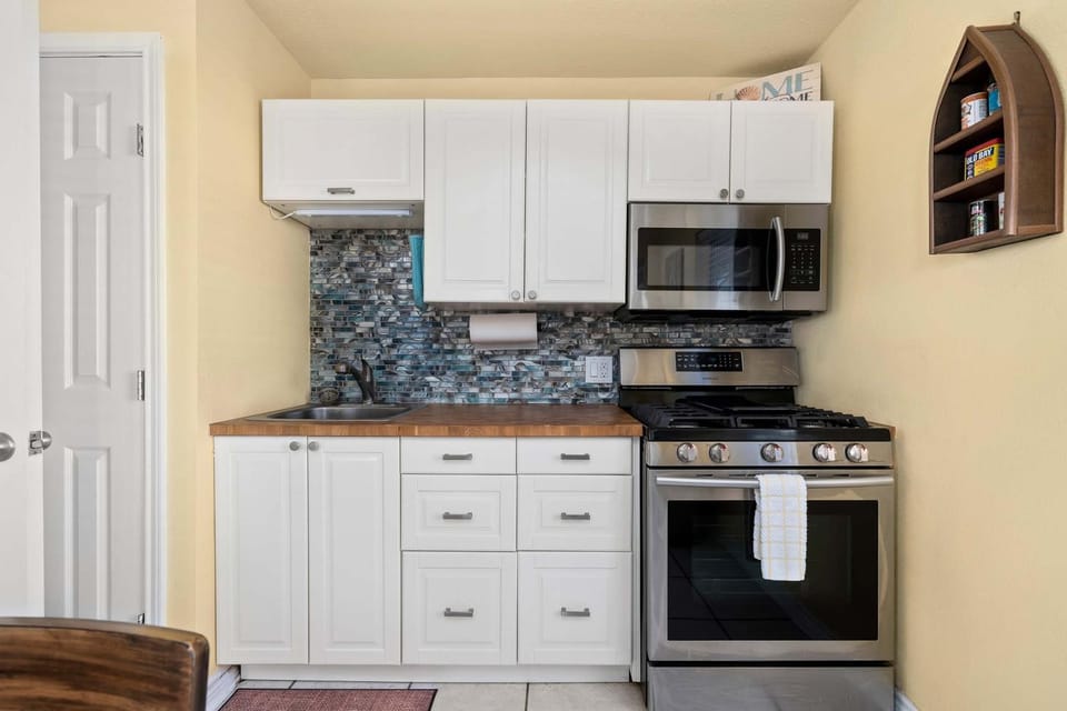Kitchen or kitchenette, microwave, oven, stove, kitchen
