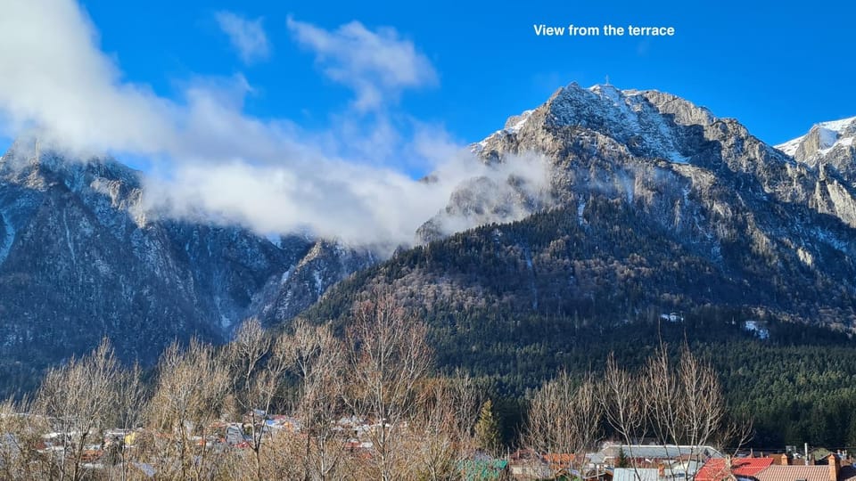 Day, Natural landscape, Balcony/Terrace, Text overlay, Mountain view