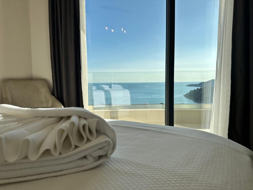 Bed, Sea view, towels