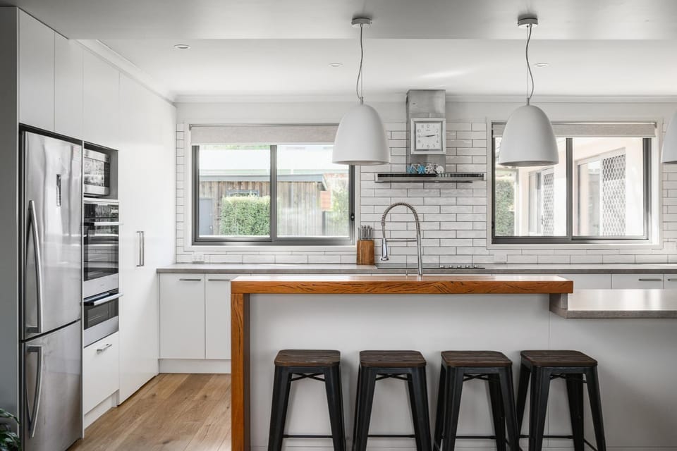 Kitchen or kitchenette, dishwasher, oven, stove