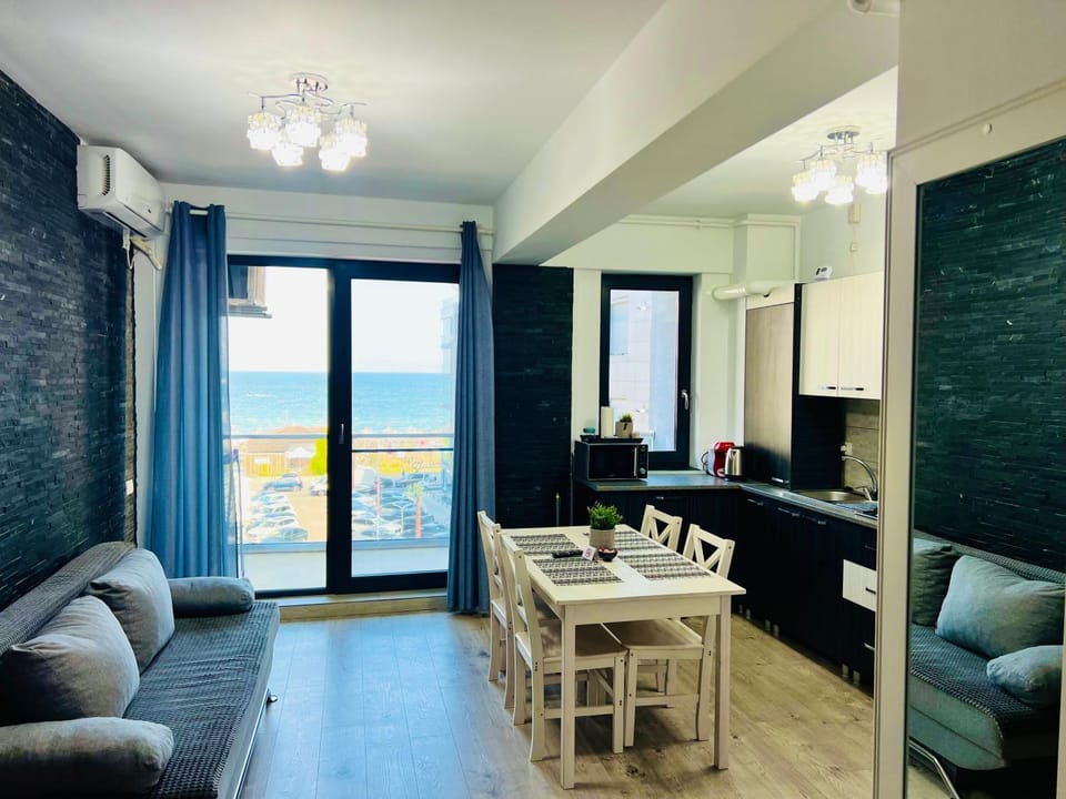 Natural landscape, Kitchen or kitchenette, Living room, Seating area, Dining area, Sea view