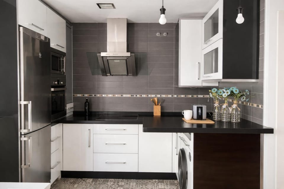 Kitchen or kitchenette, dishwasher, oven, stove