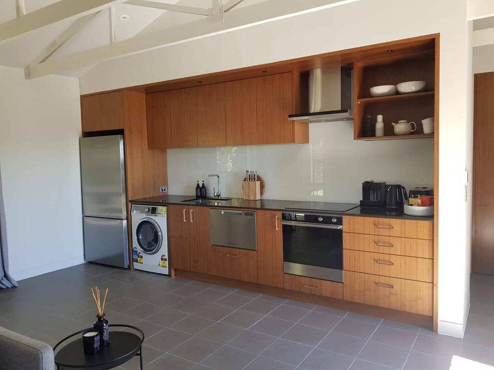 Kitchen or kitchenette, dishwasher, stove, toaster, washing machine