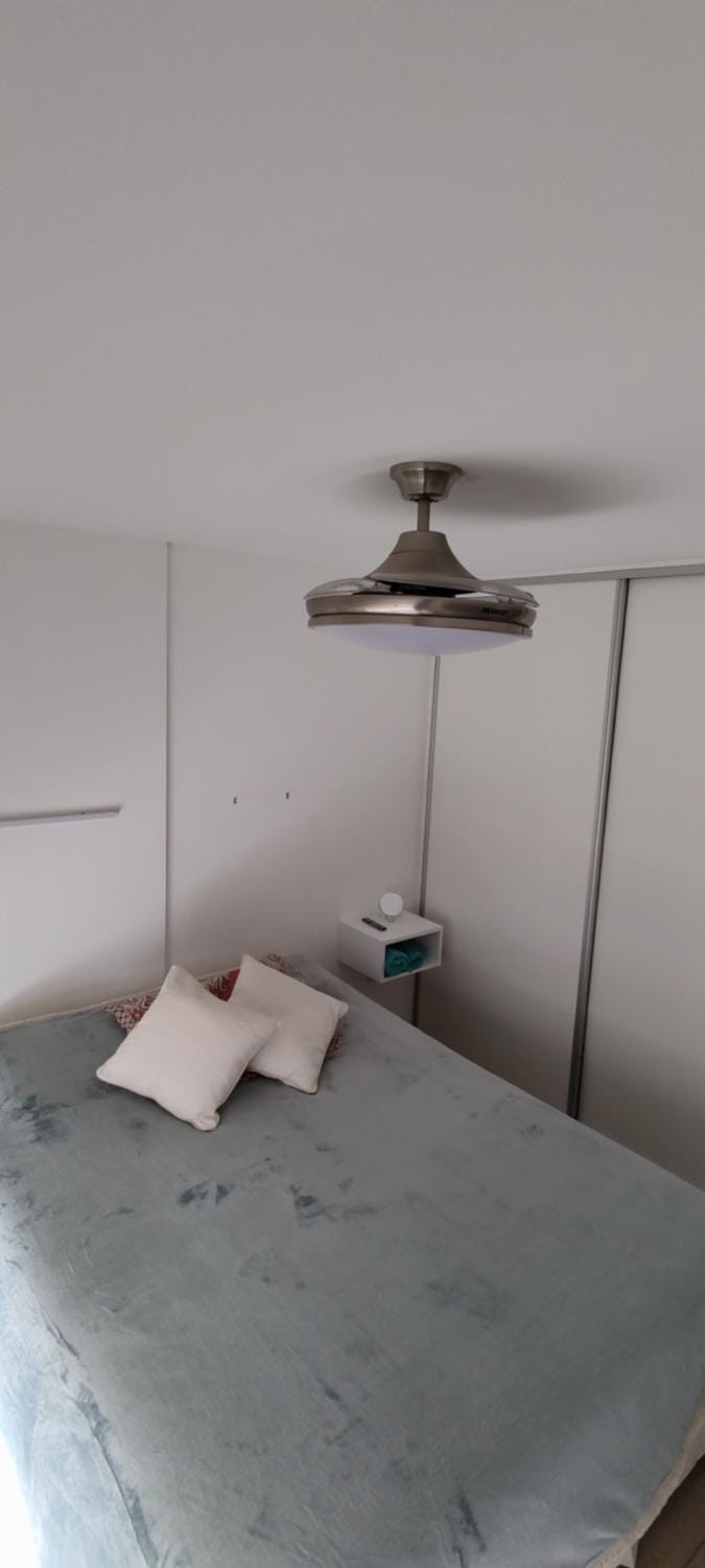 Bed, fireplace, towels