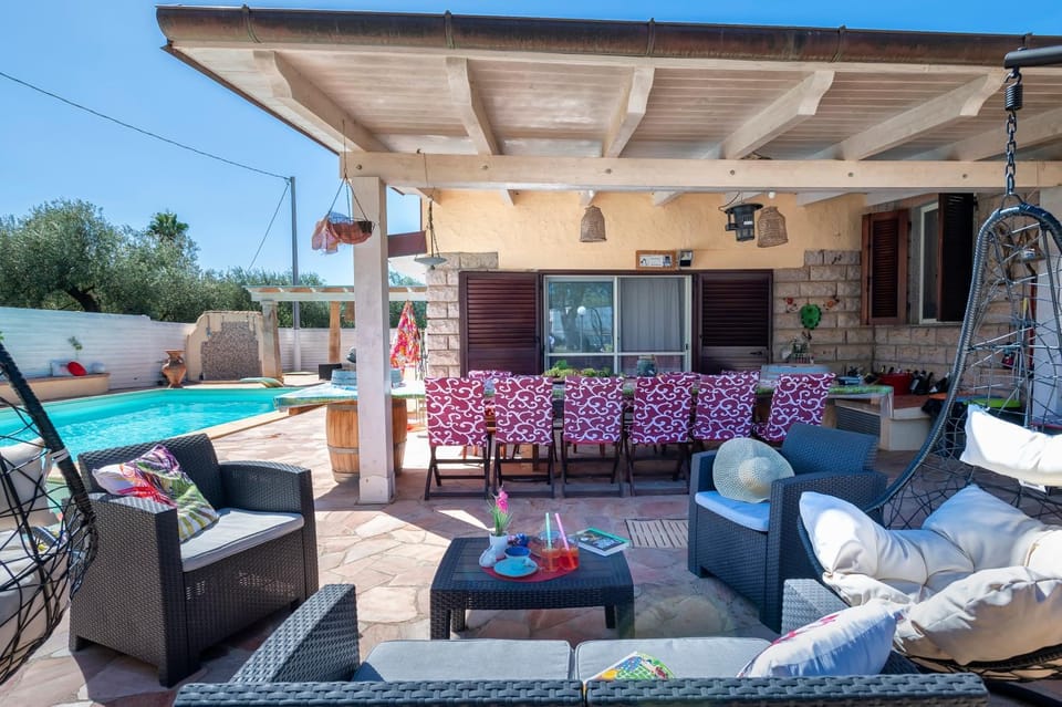 Property building, Patio, Day, Natural landscape, Pool view, Swimming pool, sunbed
