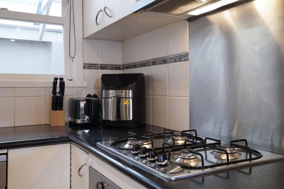 Kitchen or kitchenette, dishwasher, stove, toaster