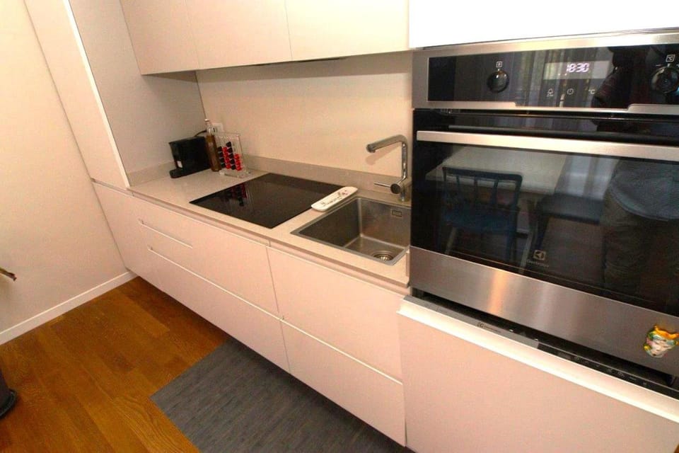Kitchen or kitchenette, dishwasher, oven, stove