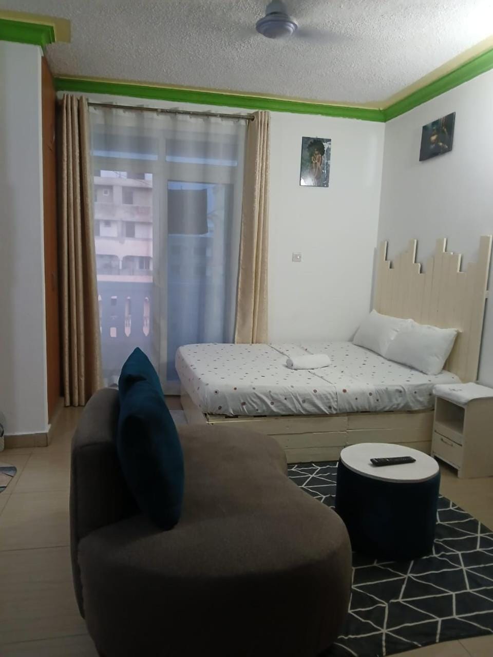 Bed, Living room, Seating area, Bedroom