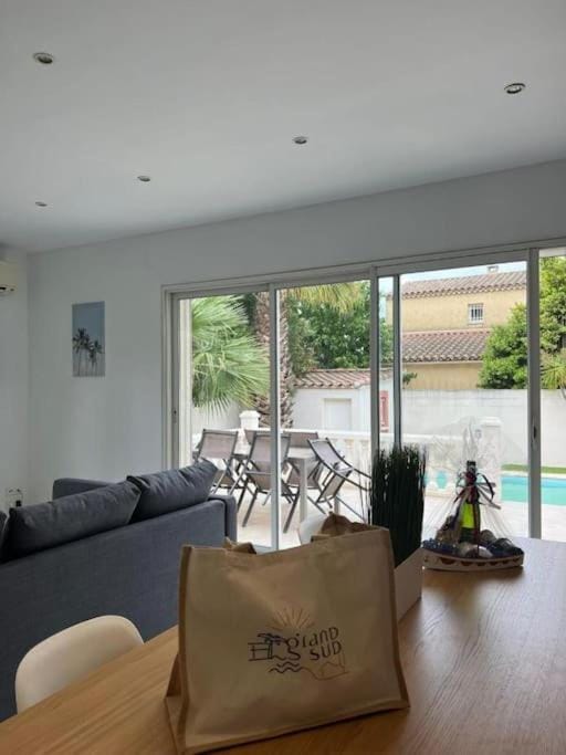 Living room, Seating area, Pool view