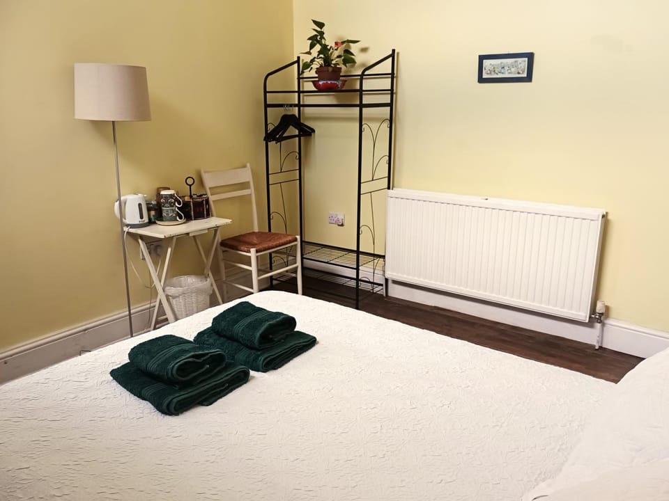 Bed, towels, wardrobe