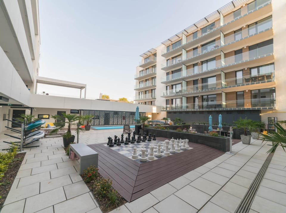 Property building, Patio, Day, Pool view, Swimming pool