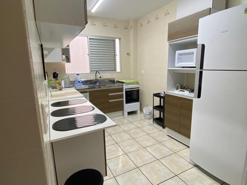 Kitchen or kitchenette, microwave, oven, stove
