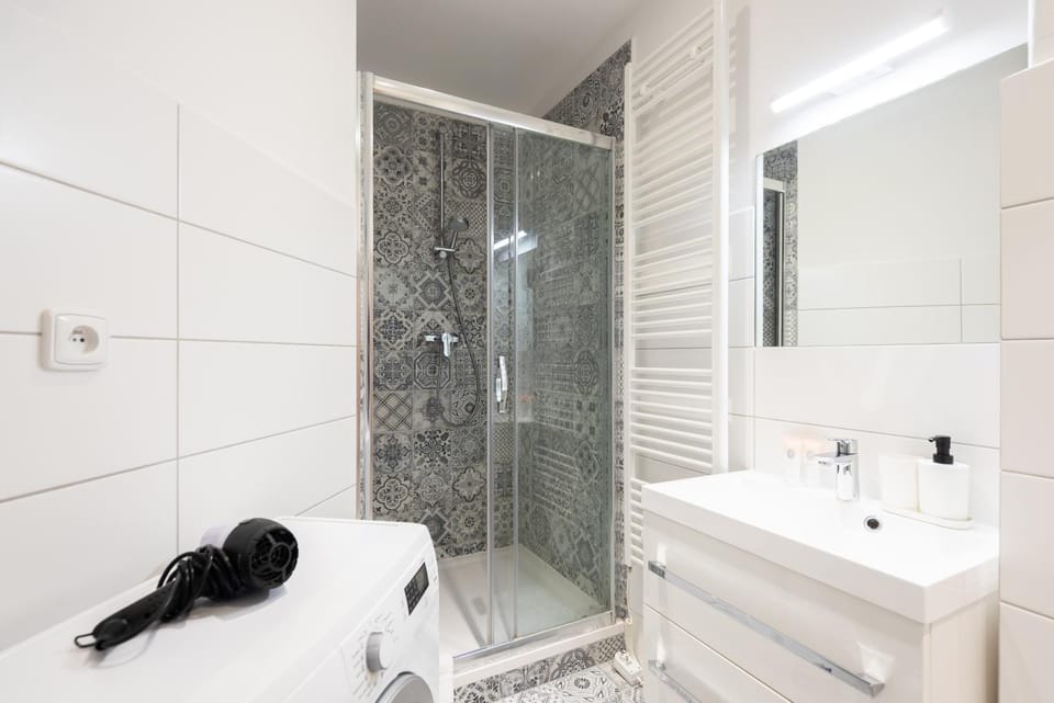 Shower, Toilet, Bathroom, hair dryier, towels