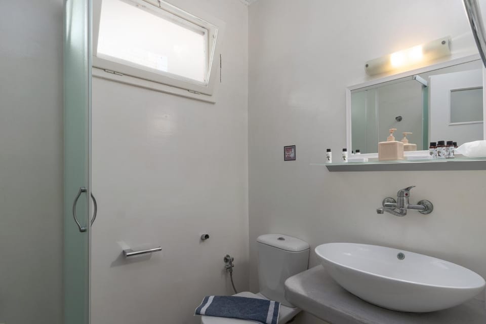 Shower, Toilet, Bathroom, hair dryier, towels