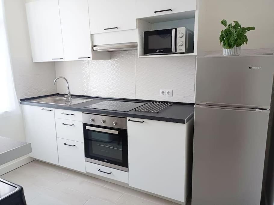 Kitchen or kitchenette, oven, stove