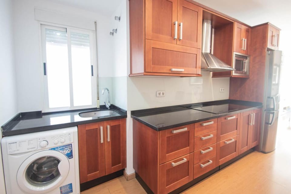 Kitchen or kitchenette, stove, washing machine