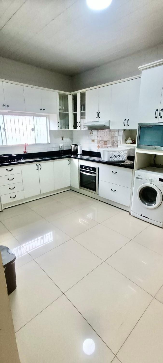 Kitchen or kitchenette, oven, stove, washing machine