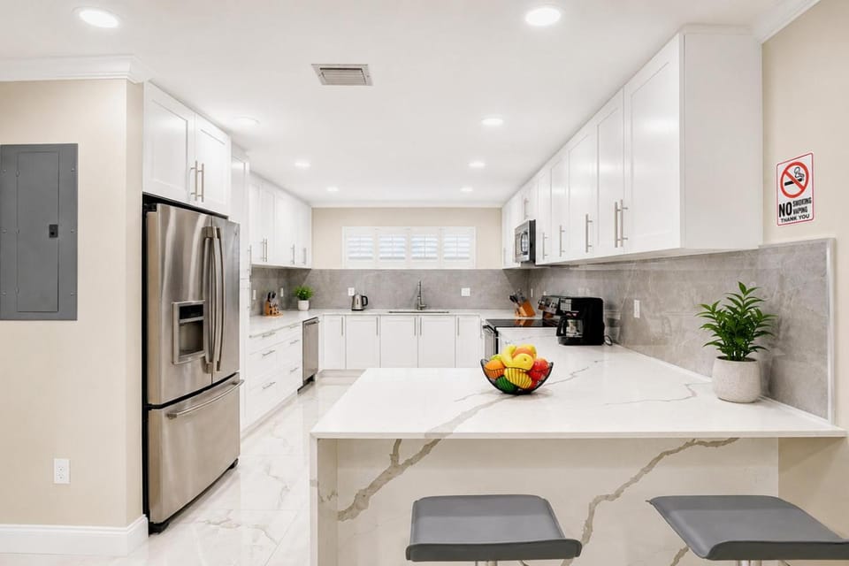 Kitchen or kitchenette, dishwasher, oven, stove