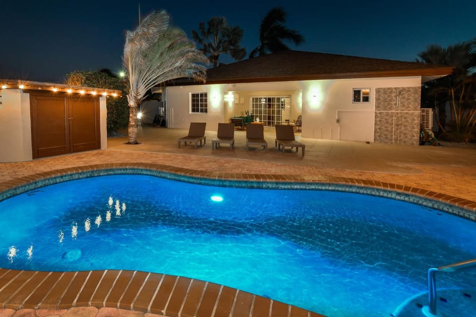 Property building, Patio, Night, Pool view, Swimming pool, sunbed