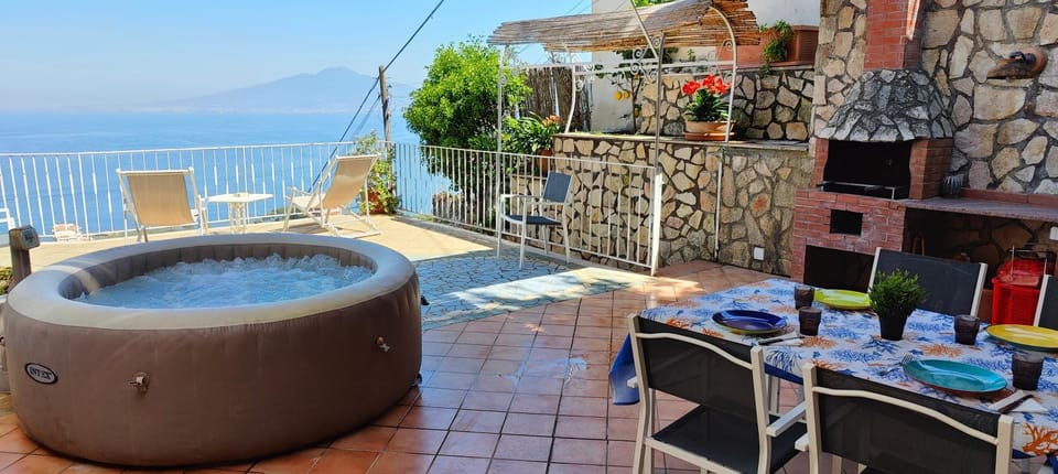Property building, Hot Tub, Balcony/Terrace, Dining area, Open Air Bath, sunbed