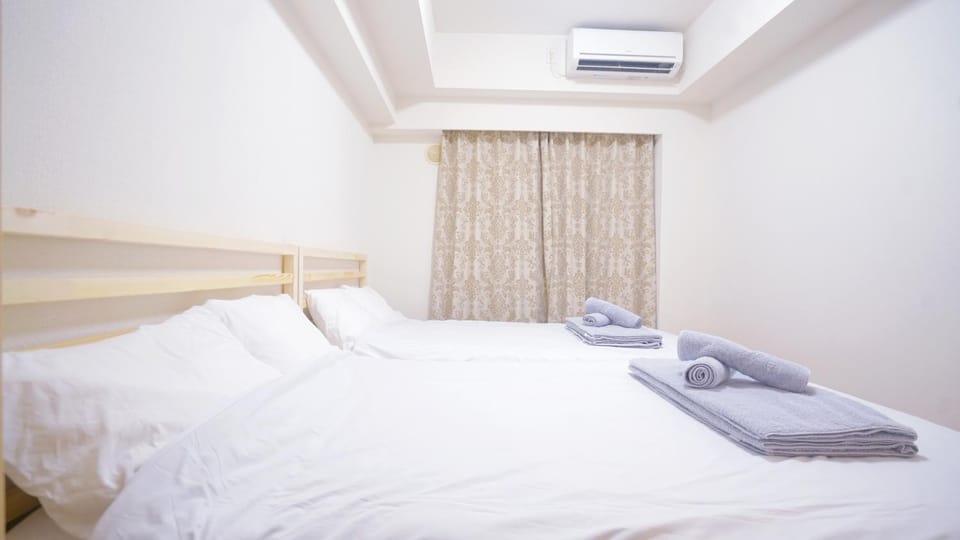 Bed, Photo of the whole room, Bedroom, towels, air conditioner