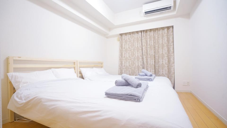 Bed, Photo of the whole room, Bedroom, towels, air conditioner