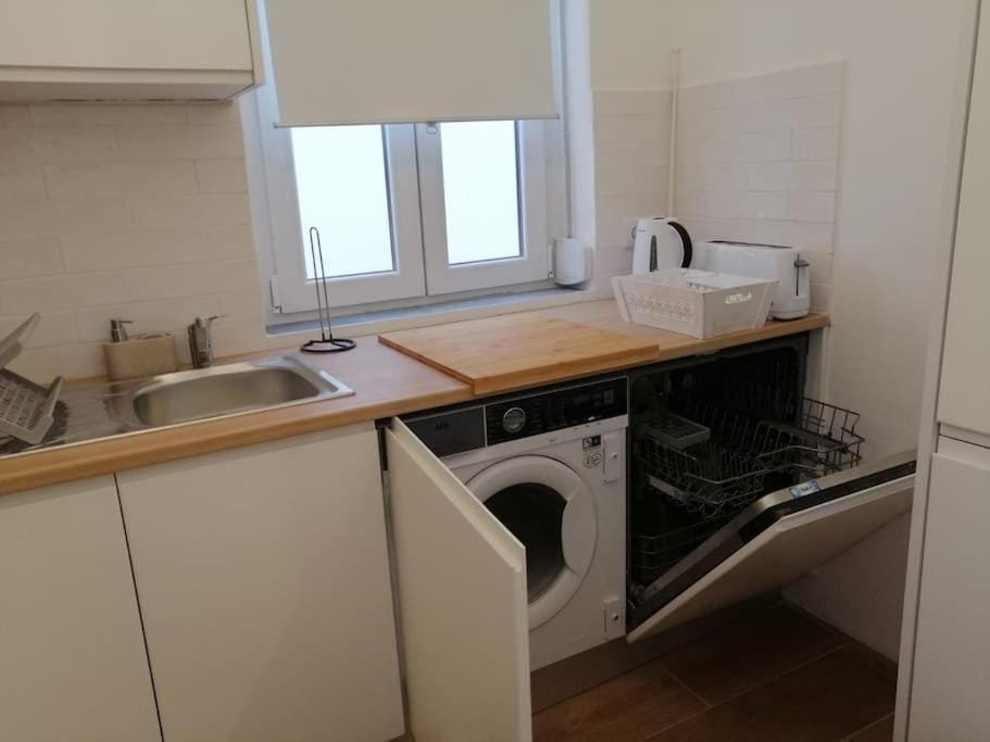 Kitchen or kitchenette, dishwasher, washing machine