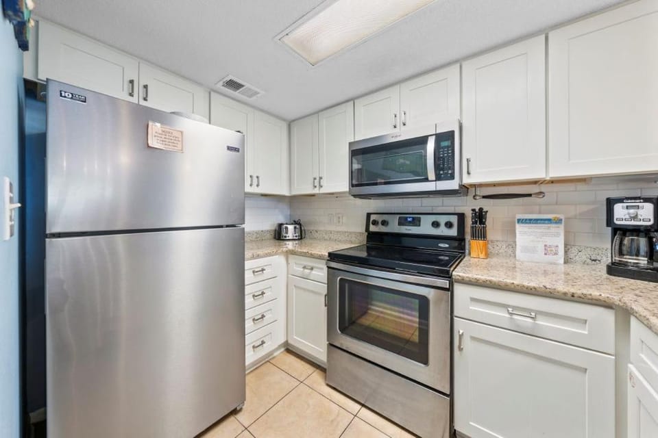 Kitchen or kitchenette, dishwasher, microwave, oven, stove, kitchen
