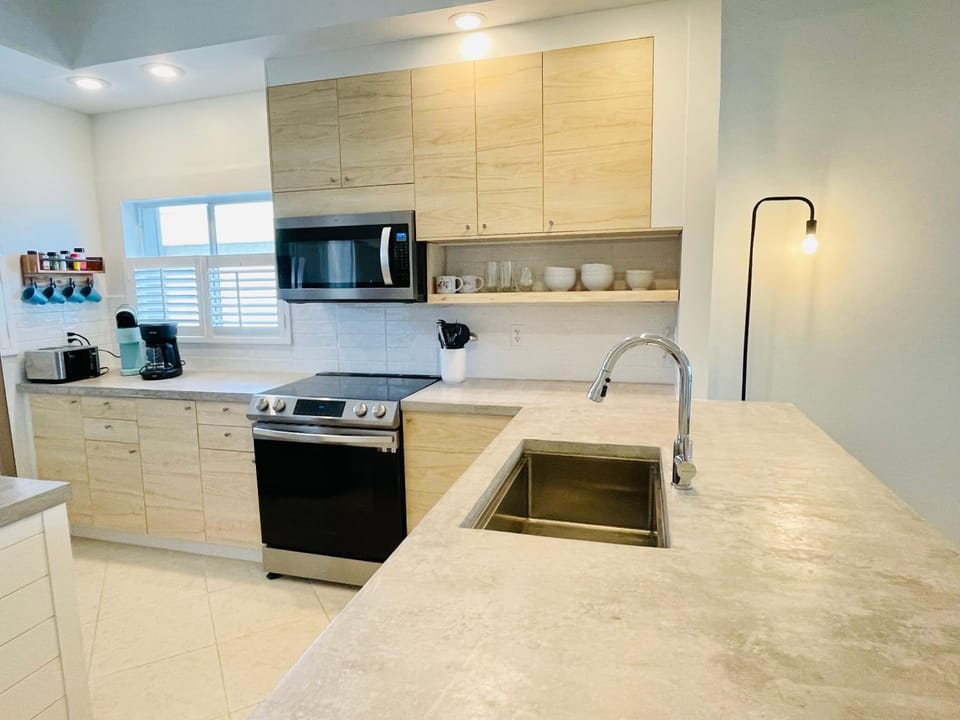Kitchen or kitchenette, dishwasher, oven, stove, toaster