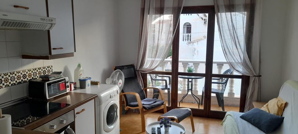 Living room, Seating area, stove, washing machine