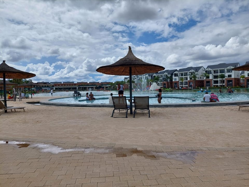 Beach, Swimming pool, group of guests, sunbed