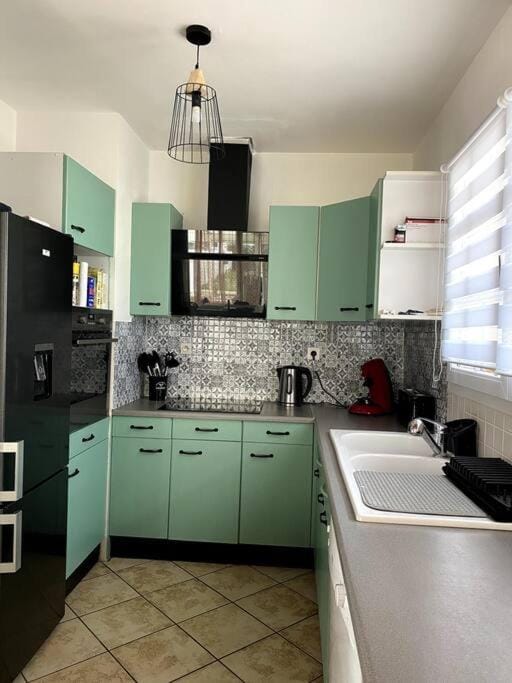 Kitchen or kitchenette, dishwasher, oven, stove